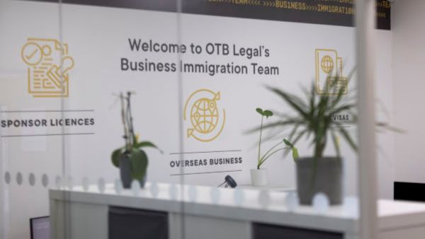 business immigration team wall art in office. business immigration premium consultation