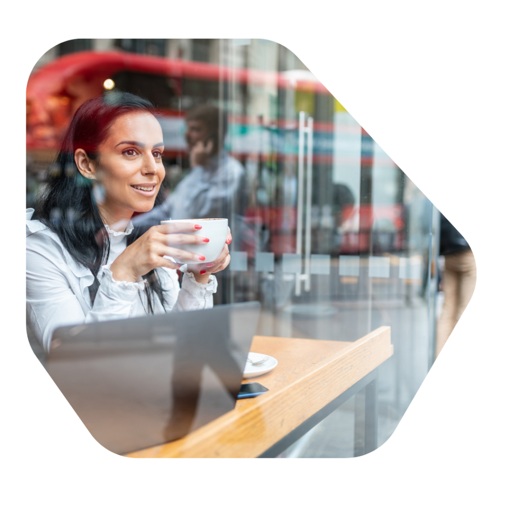 business woman in coffee shop Sole Representative of an Overseas Business UK Visa Extension Solicitor