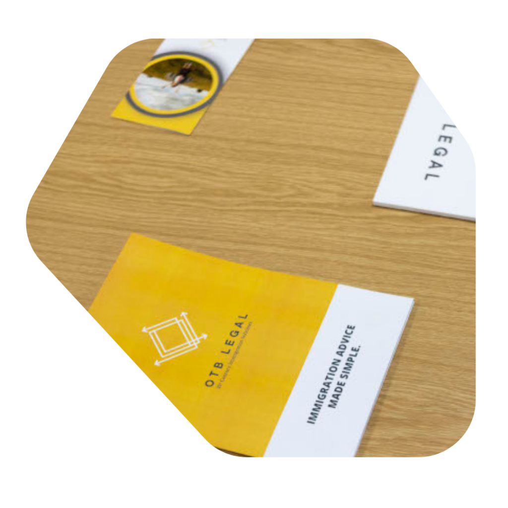 OTB Legal booklet on desk. Expansion Worker Visa UK Solicitors