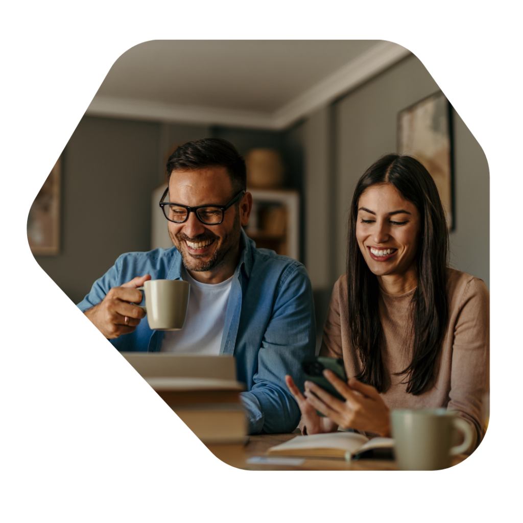 Couple at a laption looking for Sole Representative of an Overseas Business UK Visa Extension Information