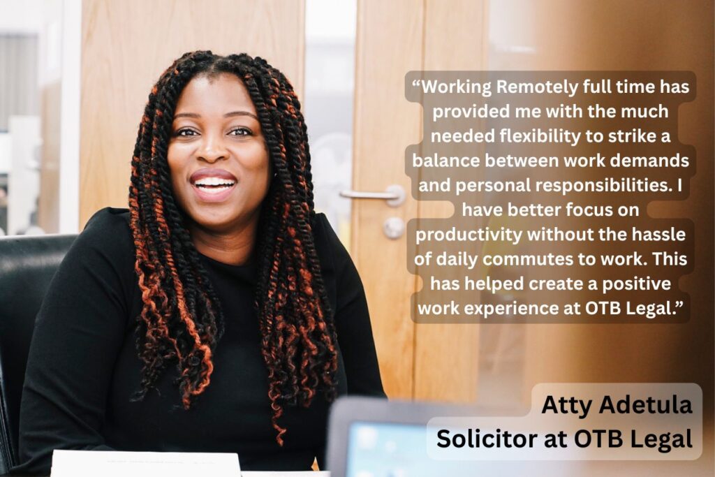 Woman laughing at desk describing working from home role